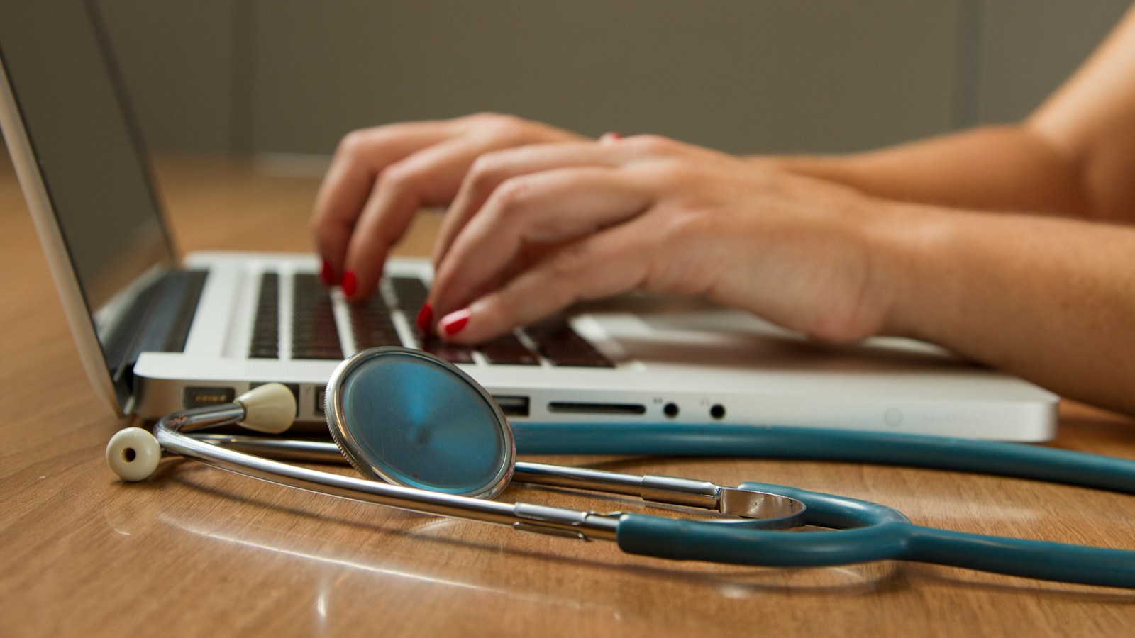 Patent Lawyer for Digital Health and Healthtech | Schell IP | Schell IP: Premier Patent Law Support Stethoscope beside a laptop used for digital healthcare work