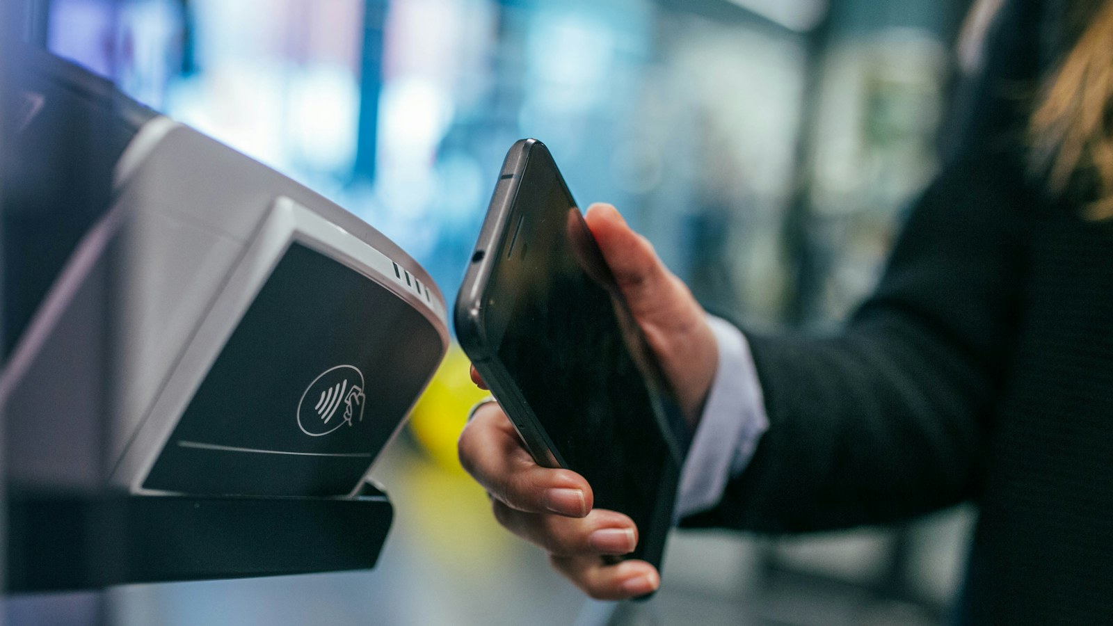 Patent Lawyer for Fintech and Financial Technology | Schell IP | Schell IP: Premier Patent Law Support Mobile device used at an electronic payment terminal